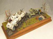 Diorama with plastic models of SdKfz 8 armored vehicle and PaK 44 anti-tank gun - photo No. 1 - front view