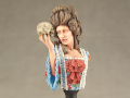 A resin bust of a woman with a skull in her hand entitled Alas - photo no 1