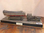 WWII diorama depicting an American M19 truck towing an LCVP landing craft on a special trailer - photo No. 1 - front view