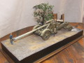 A diorama with a plastic model of the Kanone 18 German heavy gun standing on a crossroads in Berlin after WW2 - photo no 1