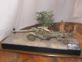 A diorama with a plastic model of the Kanone 18 German heavy gun standing on a crossroads in Berlin after WW2 - photo no 2