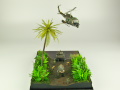 Diorama featuring a damaged M113 armored personnel carrier towing by an elephant and the Bell UH-1B helicopter flying over them - photo No. 5