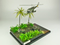 Diorama featuring a damaged M113 armored personnel carrier towing by an elephant and the Bell UH-1B helicopter flying over them - photo No. 6