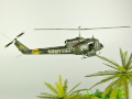 Diorama featuring a damaged M113 armored personnel carrier towing by an elephant and the Bell UH-1B helicopter flying over them - photo No. 13