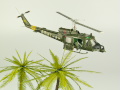 Diorama featuring a damaged M113 armored personnel carrier towing by an elephant and the Bell UH-1B helicopter flying over them - photo No. 14