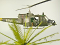 Diorama featuring a damaged M113 armored personnel carrier towing by an elephant and the Bell UH-1B helicopter flying over them - photo No. 15