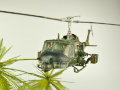 Diorama featuring a damaged M113 armored personnel carrier towing by an elephant and the Bell UH-1B helicopter flying over them - photo No. 16