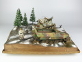 Photos shows Ardennes Offensive 1944 diorama being made in scale 1:35. The diorama includes two plastic models of German vehicles: Grille Ausf. H and Sd.Kfz. 251 Ausf.D - photo No. 1