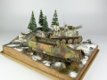 Link to photos featuring the Ardennes Offensive 1944 diorama being made in scale 1:35. The diorama includes two plastic models of German vehicles: Grille Ausf. H and Sd.Kfz. 251 Ausf.D.