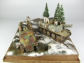 Photos shows Ardennes Offensive 1944 diorama being made in scale 1:35. The diorama includes two plastic models of German vehicles: Grille Ausf. H and Sd.Kfz. 251 Ausf.D - photo No. 3