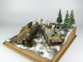 Photos shows Ardennes Offensive 1944 diorama being made in scale 1:35. The diorama includes two plastic models of German vehicles: Grille Ausf. H and Sd.Kfz. 251 Ausf.D - photo No. 4