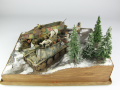 Photos shows Ardennes Offensive 1944 diorama being made in scale 1:35. The diorama includes two plastic models of German vehicles: Grille Ausf. H and Sd.Kfz. 251 Ausf.D - photo No. 5