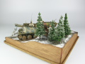 Photos shows Ardennes Offensive 1944 diorama being made in scale 1:35. The diorama includes two plastic models of German vehicles: Grille Ausf. H and Sd.Kfz. 251 Ausf.D - photo No. 6