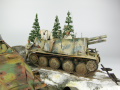 Photos shows Ardennes Offensive 1944 diorama being made in scale 1:35. The diorama includes two plastic models of German vehicles: Grille Ausf. H and Sd.Kfz. 251 Ausf.D - photo No. 9