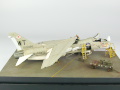 The photo shows a plastic model of the American single-seat F-8E Crusader carrier-based fighter aircraft assembled on a 1:72 scale. The model represents the F-8E aircraft from times of the Vietnam War. Photo No. 6